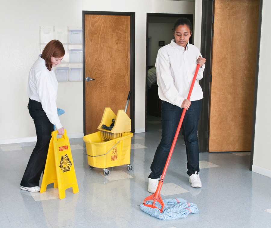 Women Cleaning Office Floor - Janitorial Services